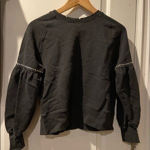 A black sweater: